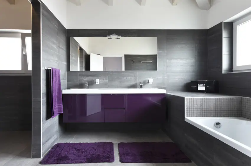 Bathroom with purple sink cabinet and grey theme