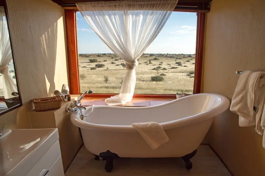 Bathtub with beautiful view from window