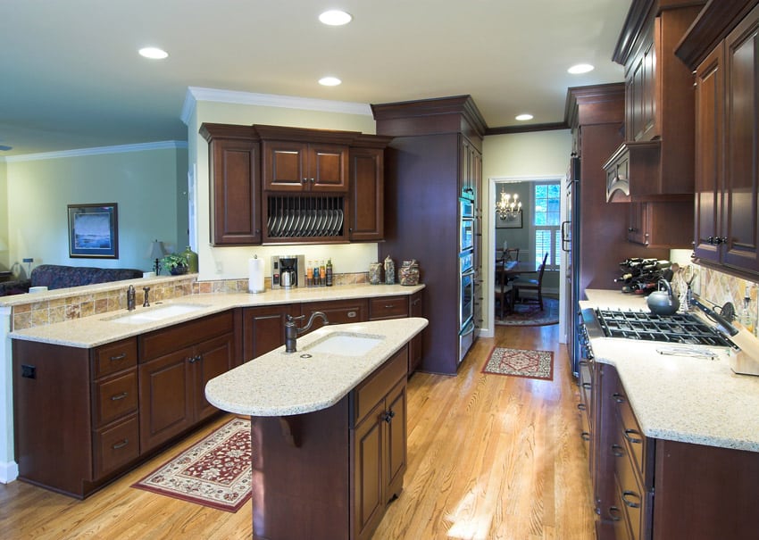 Beautiful light color counter kitchen with dark wood cabinetry