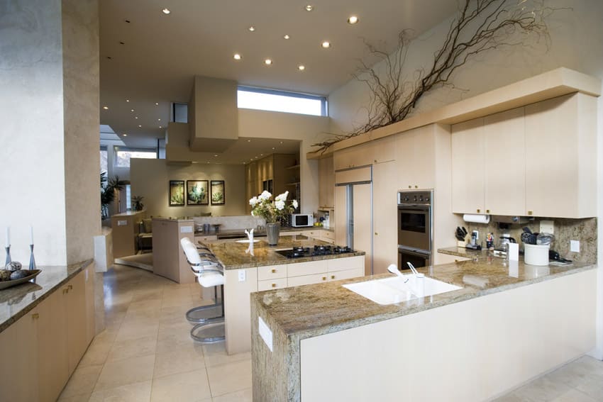 Beautiful white kitchen with center eat in dining island