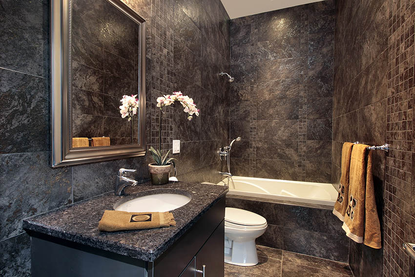 Luxury powder room with black granite walls