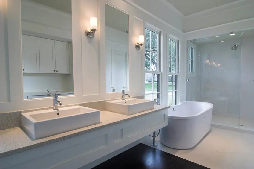 Clean white bathroom design with dual sinks
