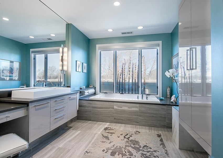 Contemporary master bathroom with slate flooring and enclosure