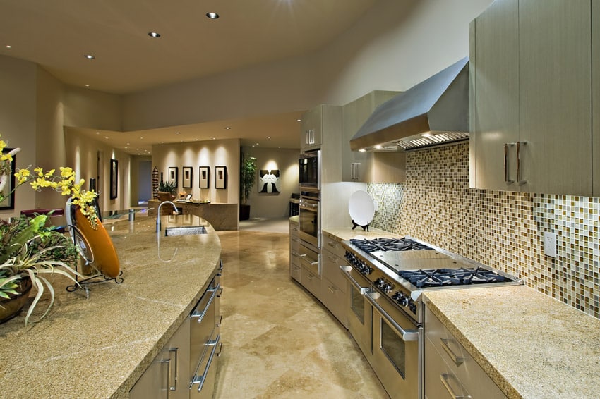 Curved counter kitchen with tile backsplash