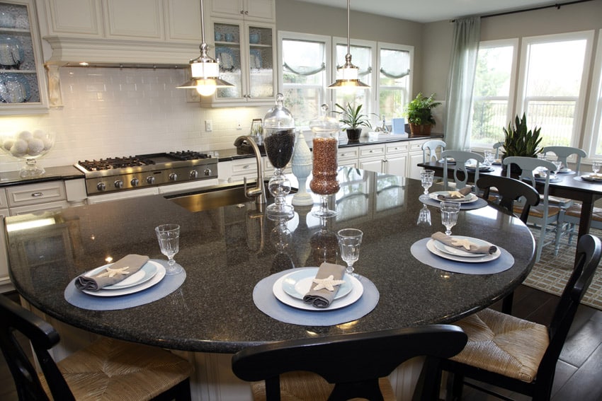 Curved eat in dining kitchen island with dark surface