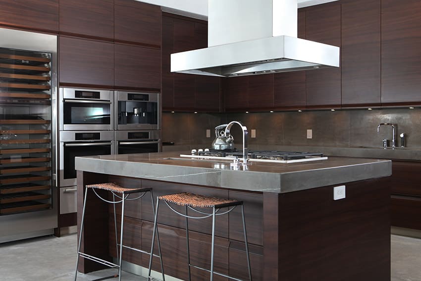 Dark wood modern kitchen with stylish concrete counters