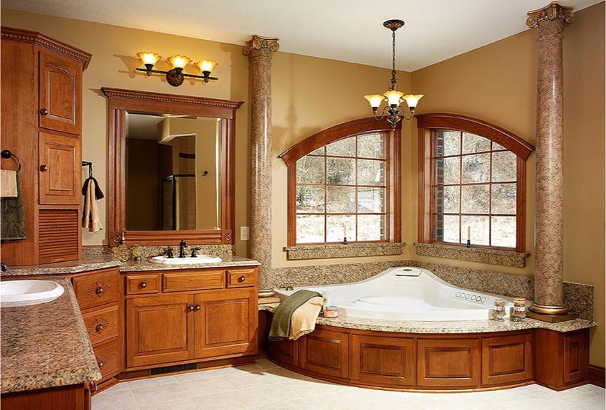 decorative bathroom design with large tub with pillars