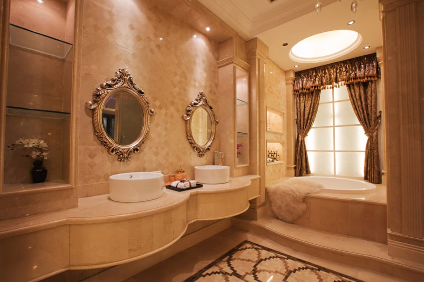 Elegant bathroom with round sinks and large soaking tub