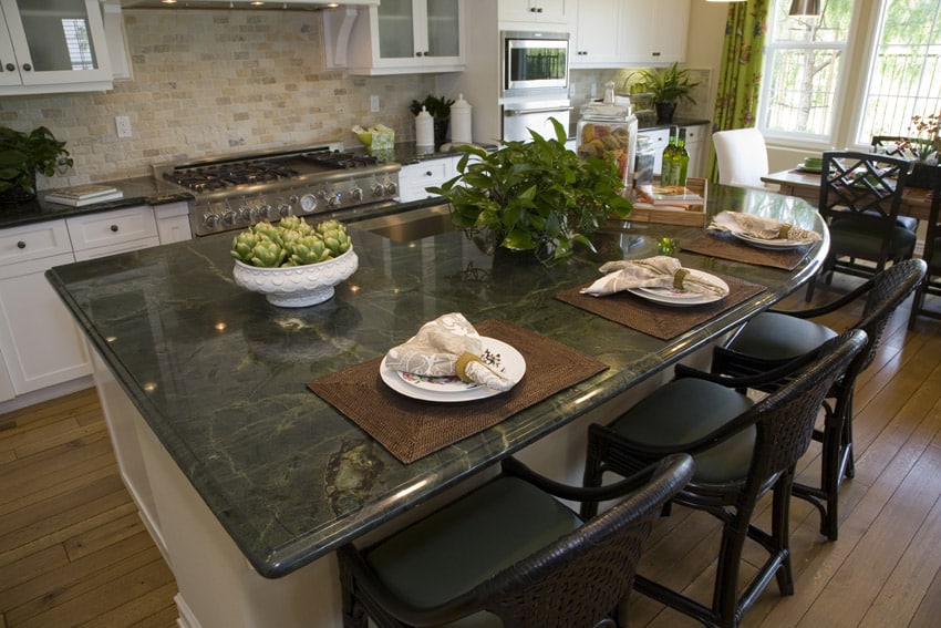 Kitchen with stone surface and backsplash
