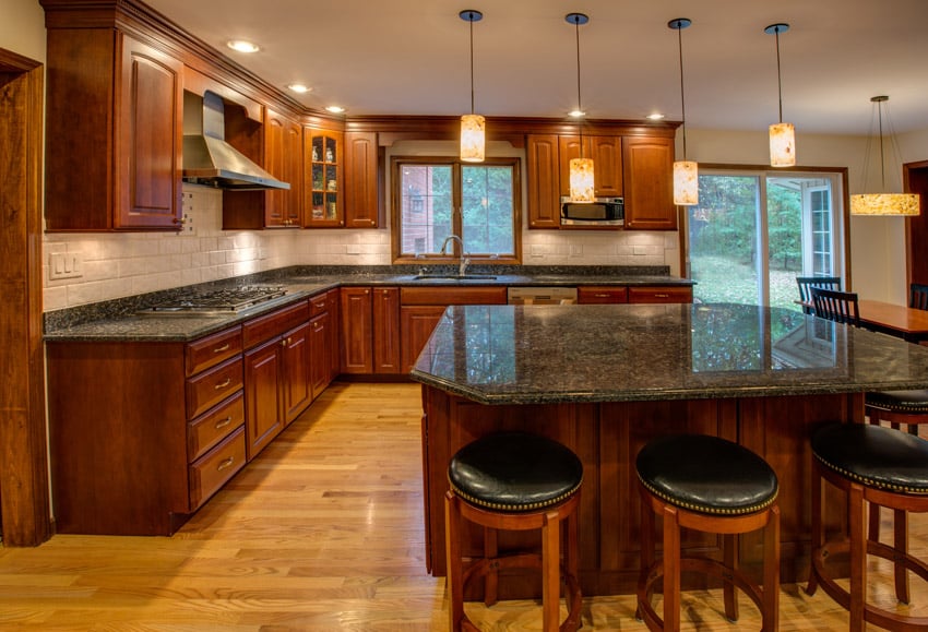 Kitchen with oversized island and wooden cabinets