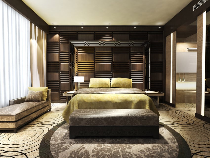 Wood paneled wall, a lounge bed and brocade storage bench