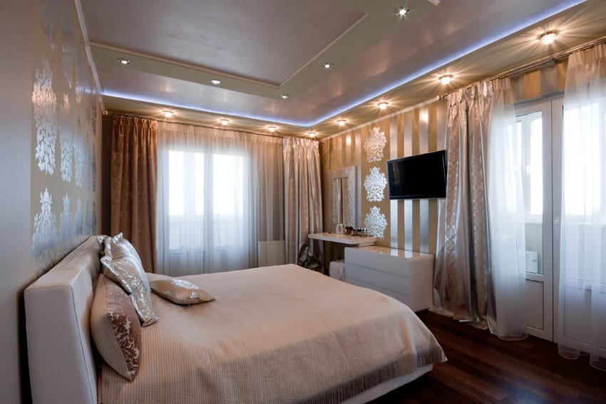 Bedrom with interesting wall decor and recessed lighting