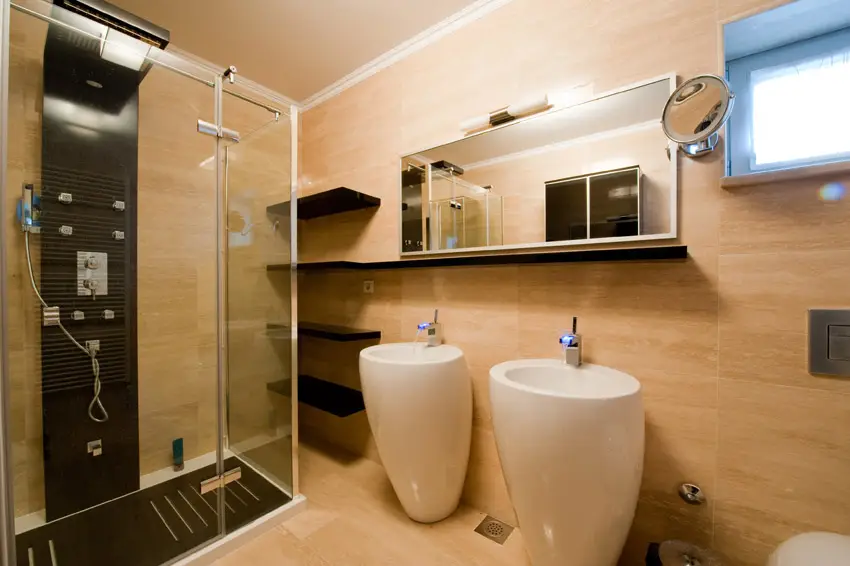Interesting vessel sinks in bathroom with glass shower 