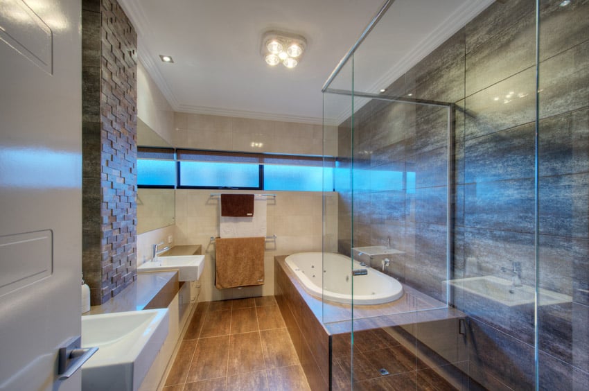 Interior designed bathroom with glass shower enclosure