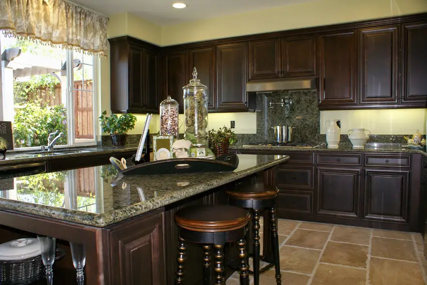Intricate wood and granite kitchen island and cabinets