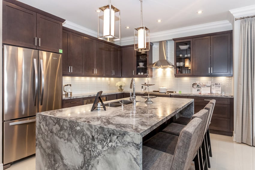 Kitchen with soapstone island with eat in dining