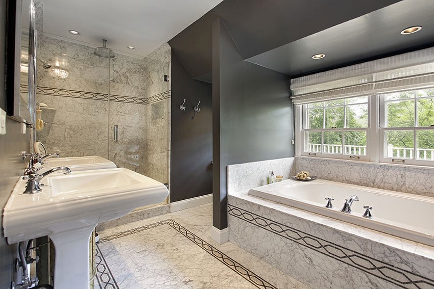 Modern master bath with marble flooring and glass shower