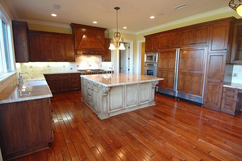 Luxury wood kitchen with large center island in lighter color