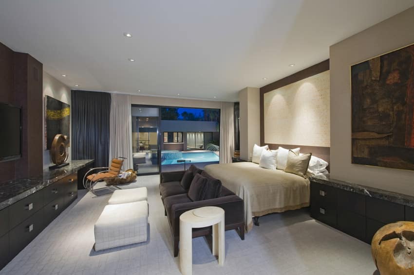 Master bedroom with entertainment center and pool view