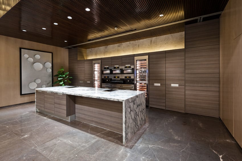 Kitchen with modular cabinets and wood slat ceiling