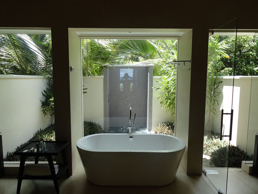 Spa designed master bathroom suite with garden view