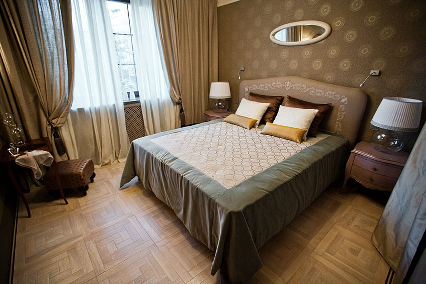 Rich brown bedroom design with parquet floors