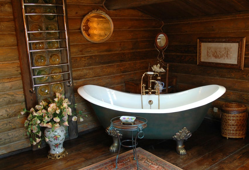 Rustic bathroom in wood with claw foot bathtub