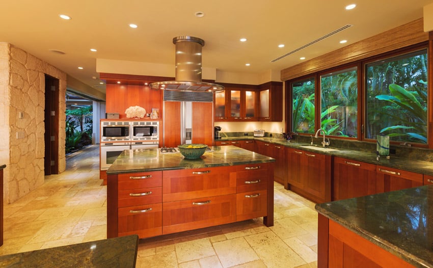 Stunning luxury kitchen with large island and tropical view