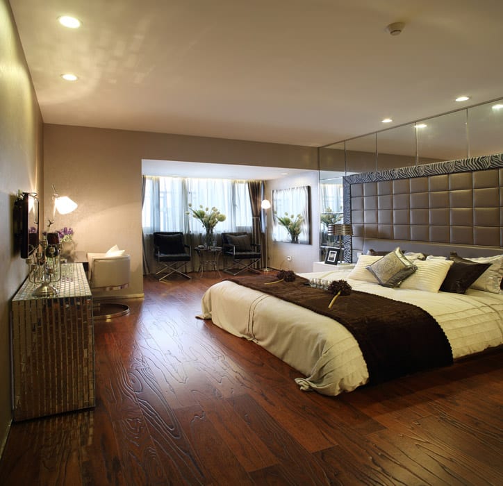 Wood floor grey headboard in bedroom