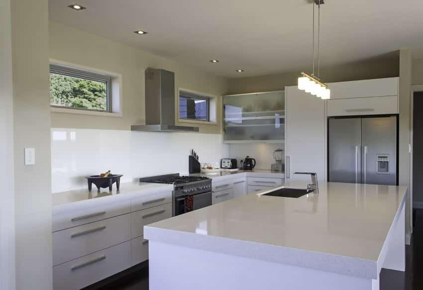 Kitchen with stainless appliances and solid surface island