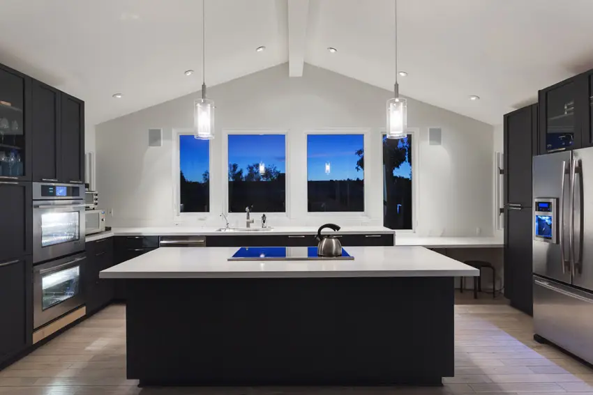 Arched ceiling in modern kitchen with large center island