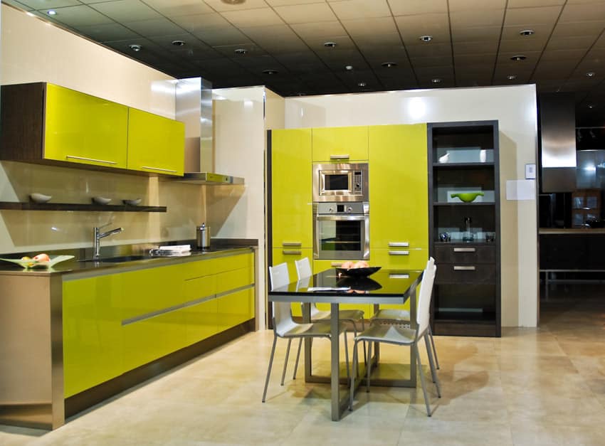 Kitchen with cabinets with dark yellow surface and teak wood combination