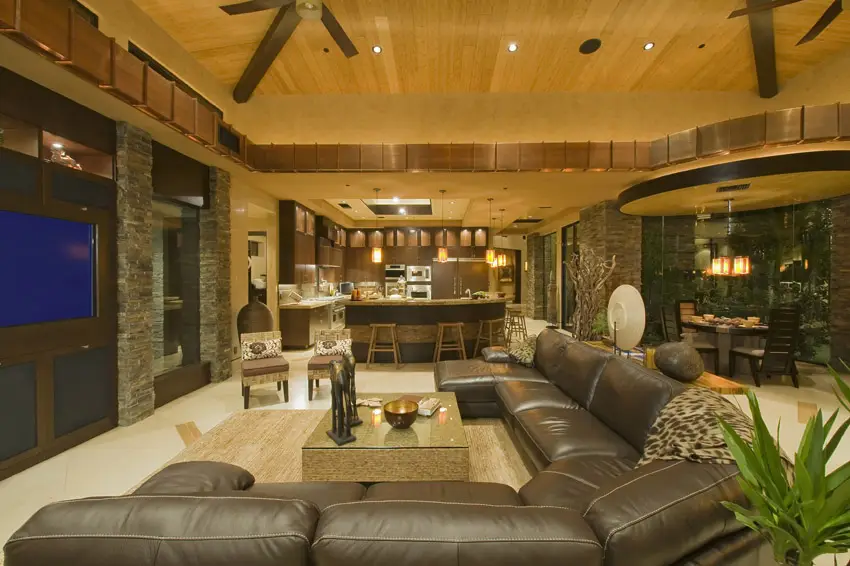 Comfortable living room in luxury home with large leather sectional sofa