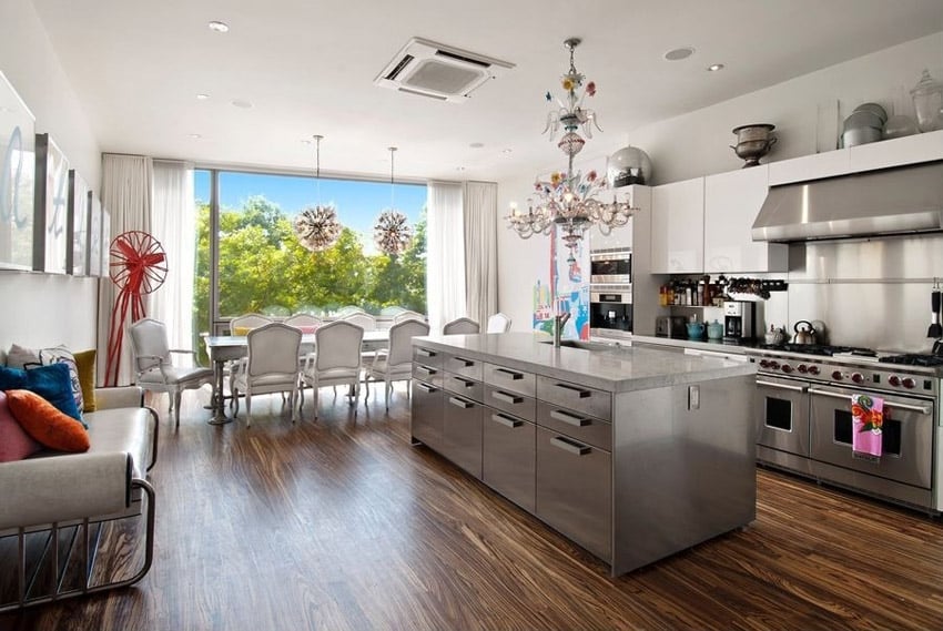 Contemporary kitchen with chandelier stainless island