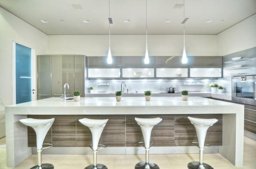 Kitchen with hickory laminate counter base and molded plastic bar chair in white color