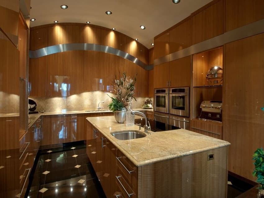 Contemporary kitchen with rich wood cabinets black granite counters