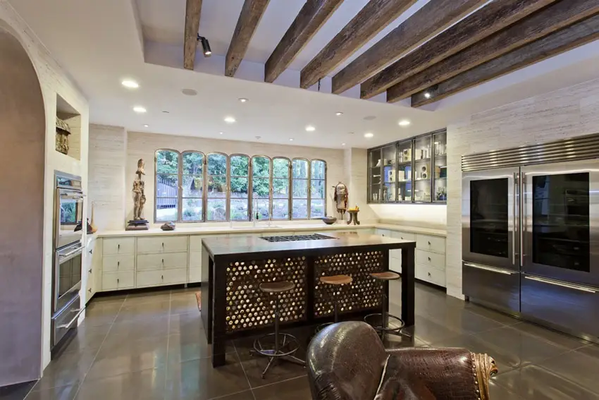 Kitchen counter with mother of pearl accent, leather chair and arched doorway