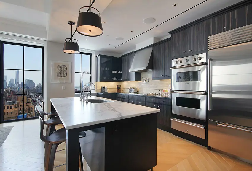 Kitchen with calacatta marble tops and black sable wood cabinets