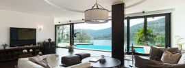 living-room-with-pool-view-and-circular-tray-ceiling