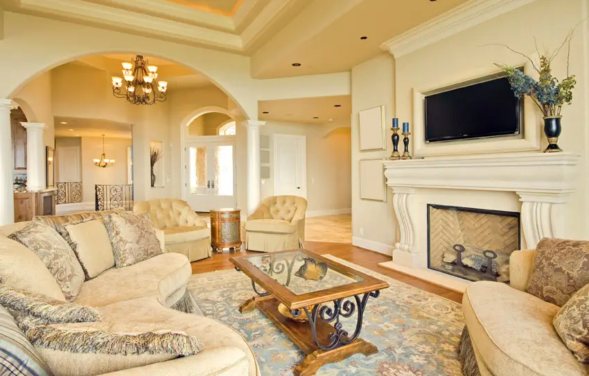 Luxury living room with arched wall white fireplace