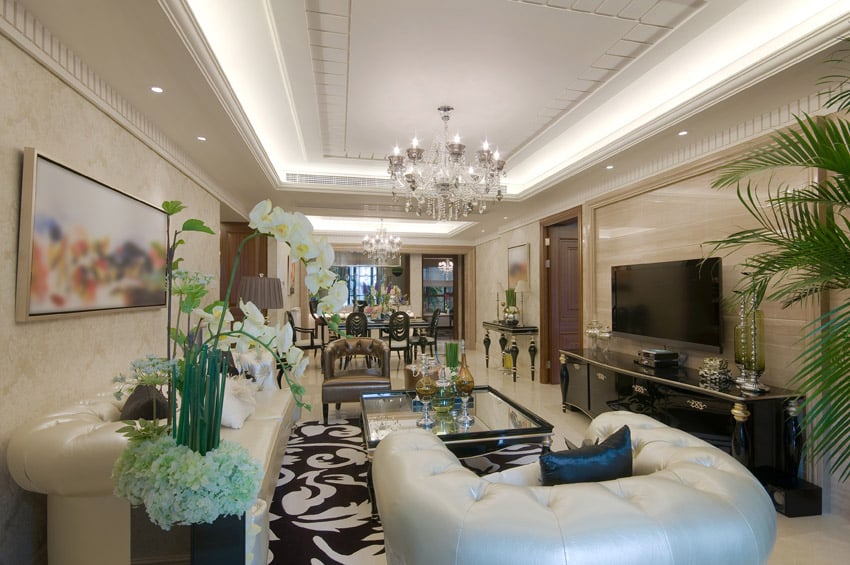 Luxury living room with white couches and black cabinet