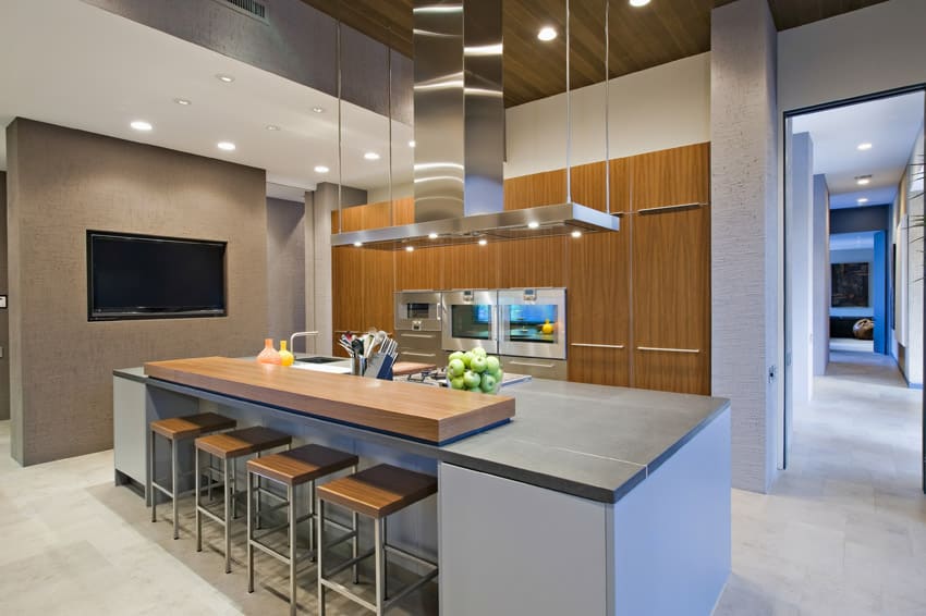 Modern kitchen in upscale house with breakfast bar island