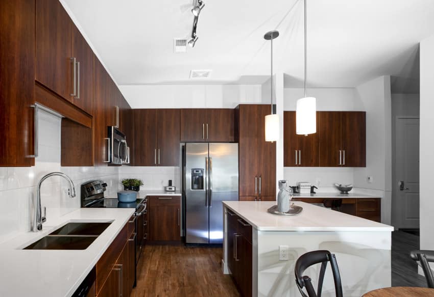 Modern kitchen with brown cabinets and white countertops