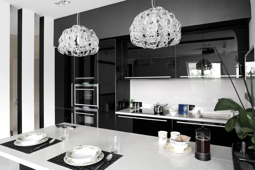 Modern kitchen with dual chandeliers