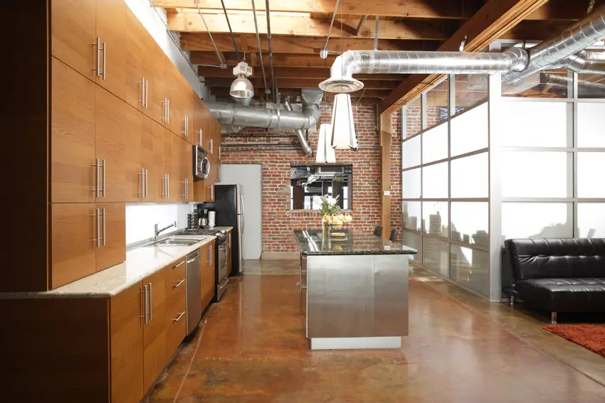 Industrial style loft with brick wall and exposed duct work
