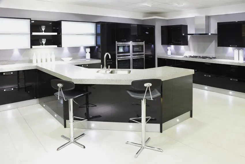 Open plan modern kitchen with large wraparound island