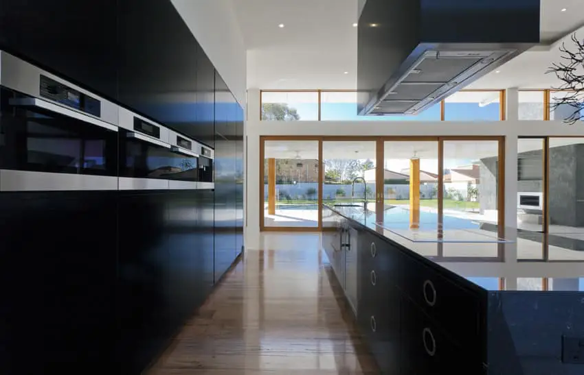 Sleek black modern kitchen with view