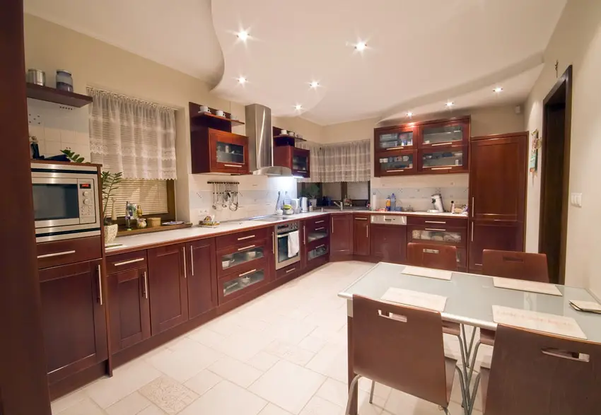 Spacious modern kitchen with brown white theme