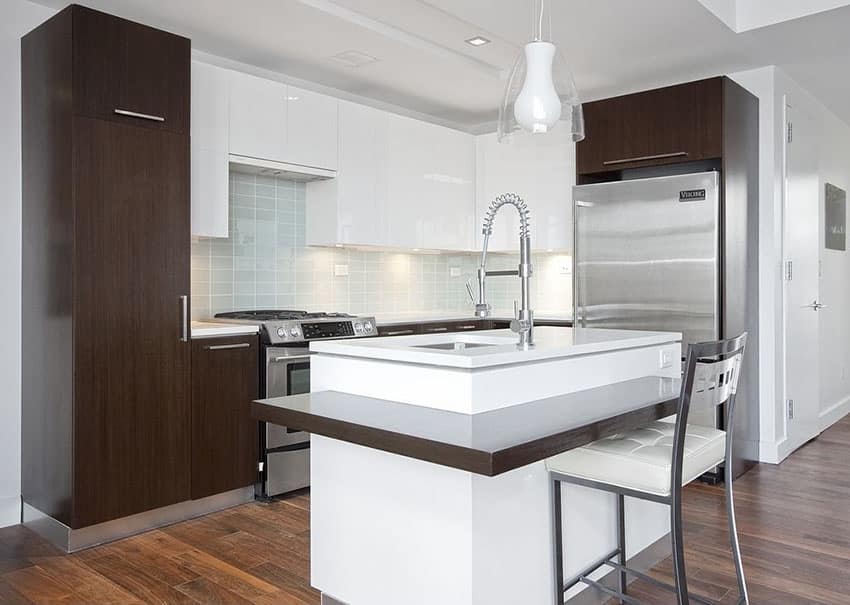 Kitchen with brown and white color theme with single metal stool