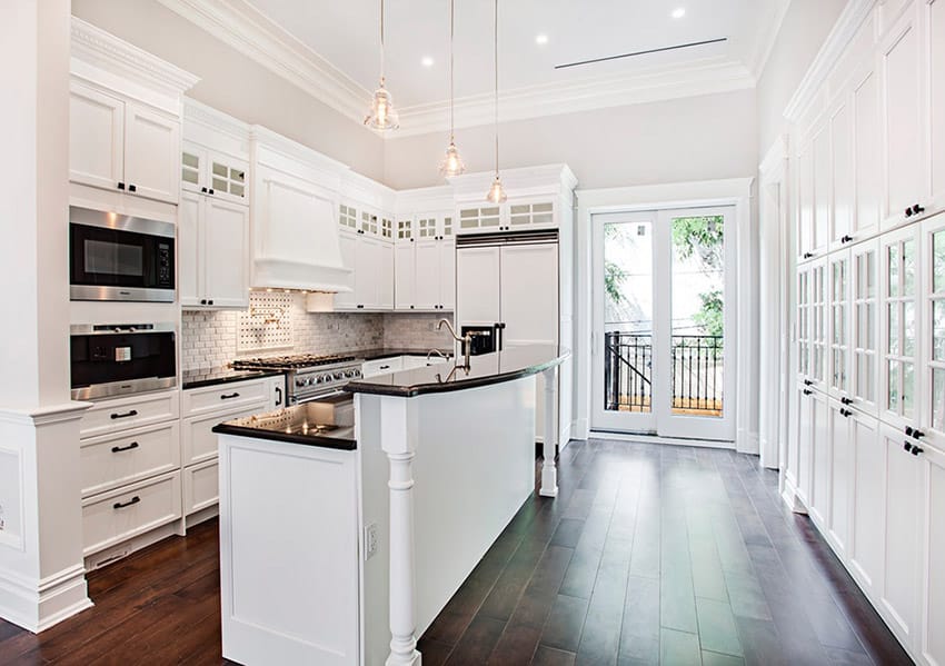 White washed kitchen with black countertop